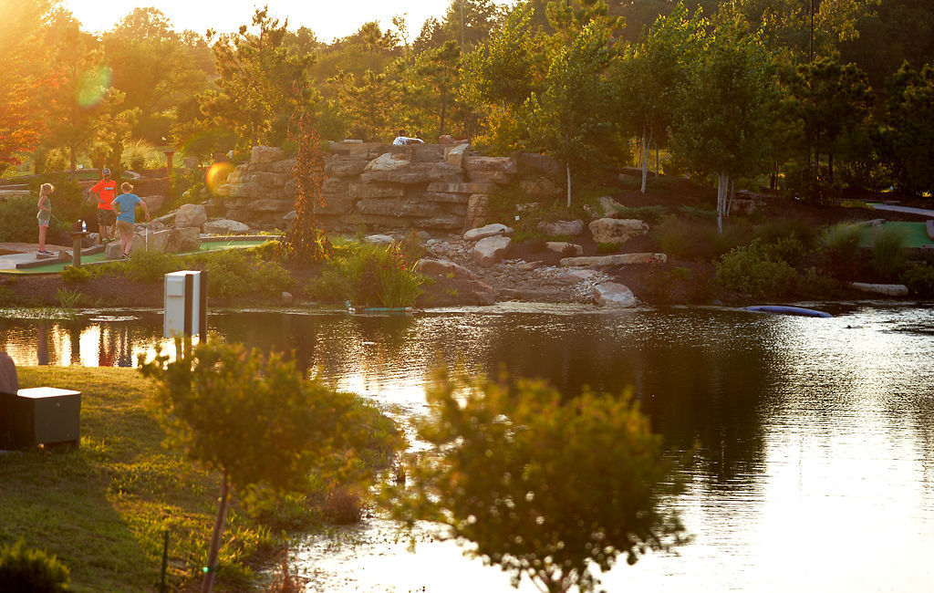 Competitors play mini golf